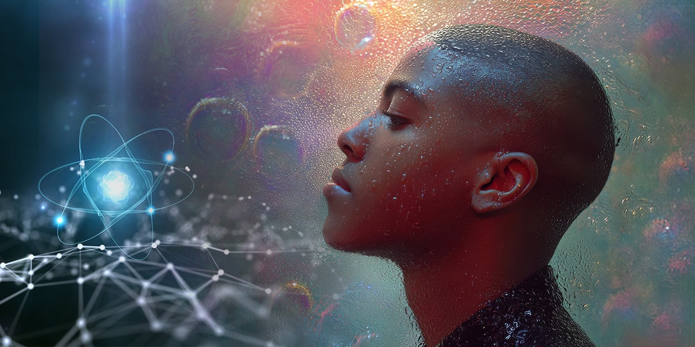 Young man contemplating while an atom emerges